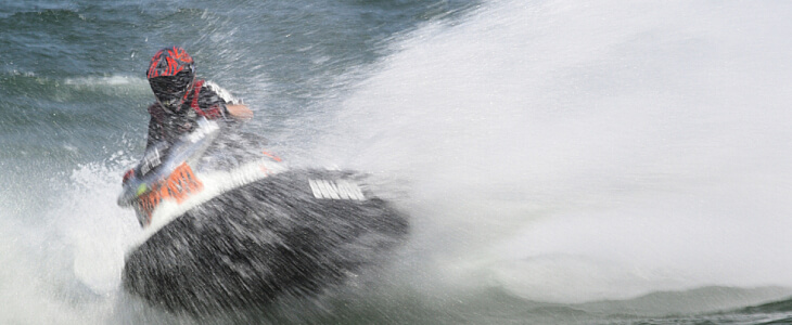 person riding a jet ski